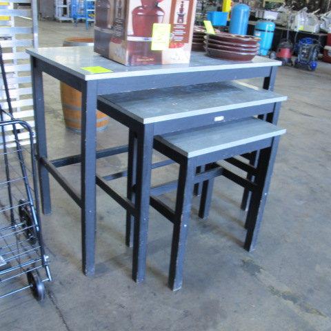 black wooden merchandising tables w/ galvanized tops