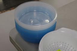 Plastic collanders and bowls with lids.