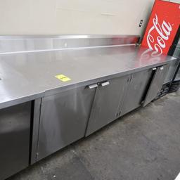 stainless table w/ backsplash & cabinets under