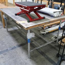 butcher block table on stainless frame