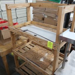 wooden merchandising rack, on pallet base