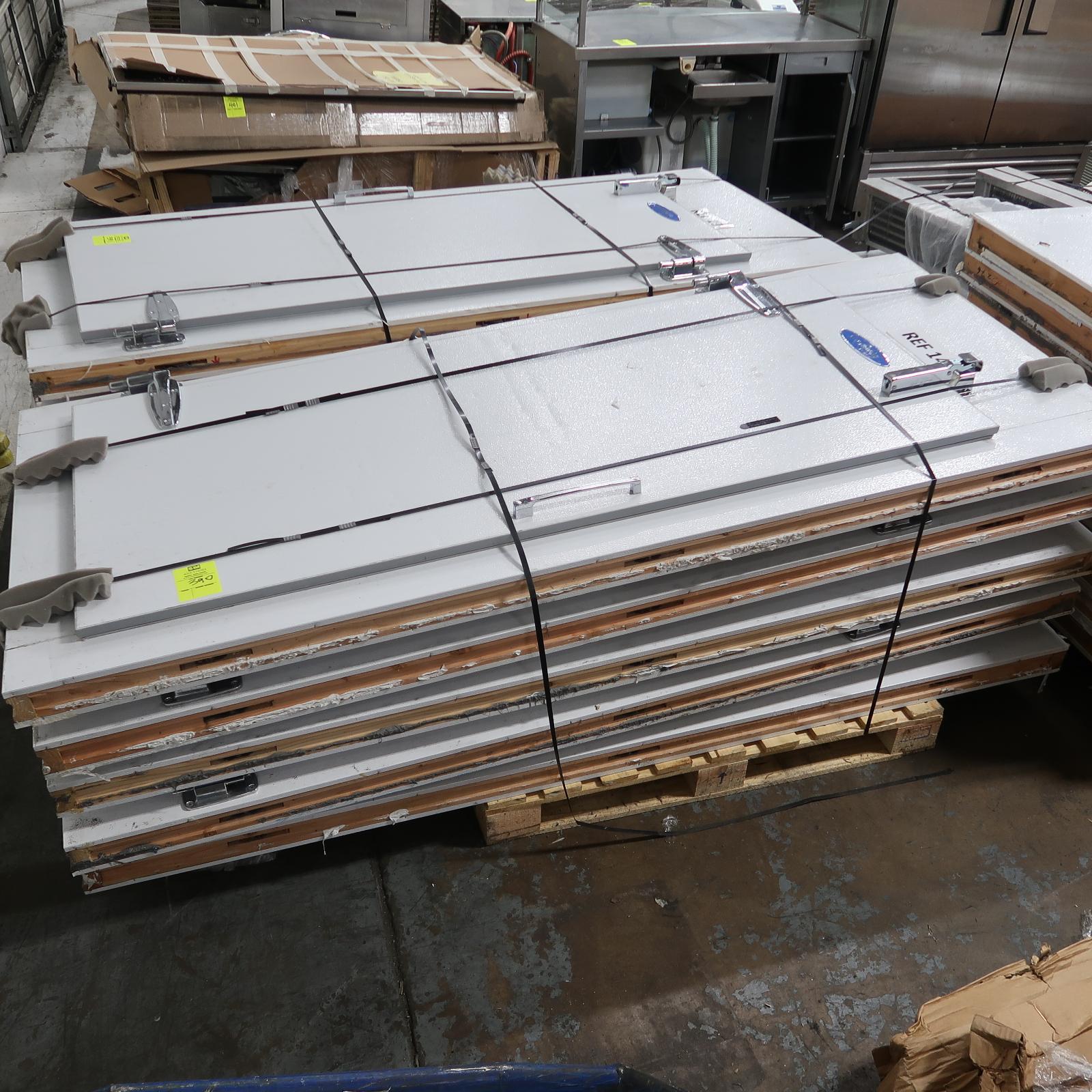 pallet of walk-in man-doors, mounted in panels