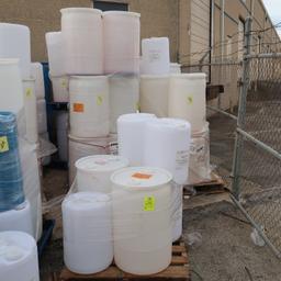 pallets of plastic barrels