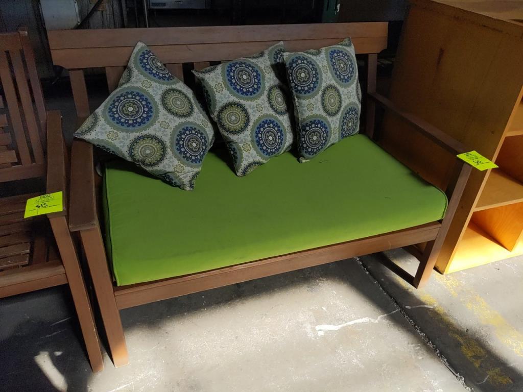 Wood bench with cushion and throw pillows