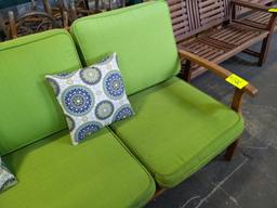 Wood bench with cushion and throw pillows