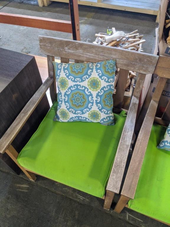 Wood chairs with cushions and throw pillows