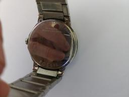 Fossil watch and LG cell phone (damaged)