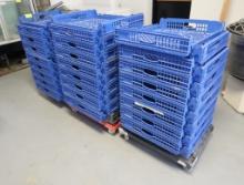 stacks of bakery trays on carts