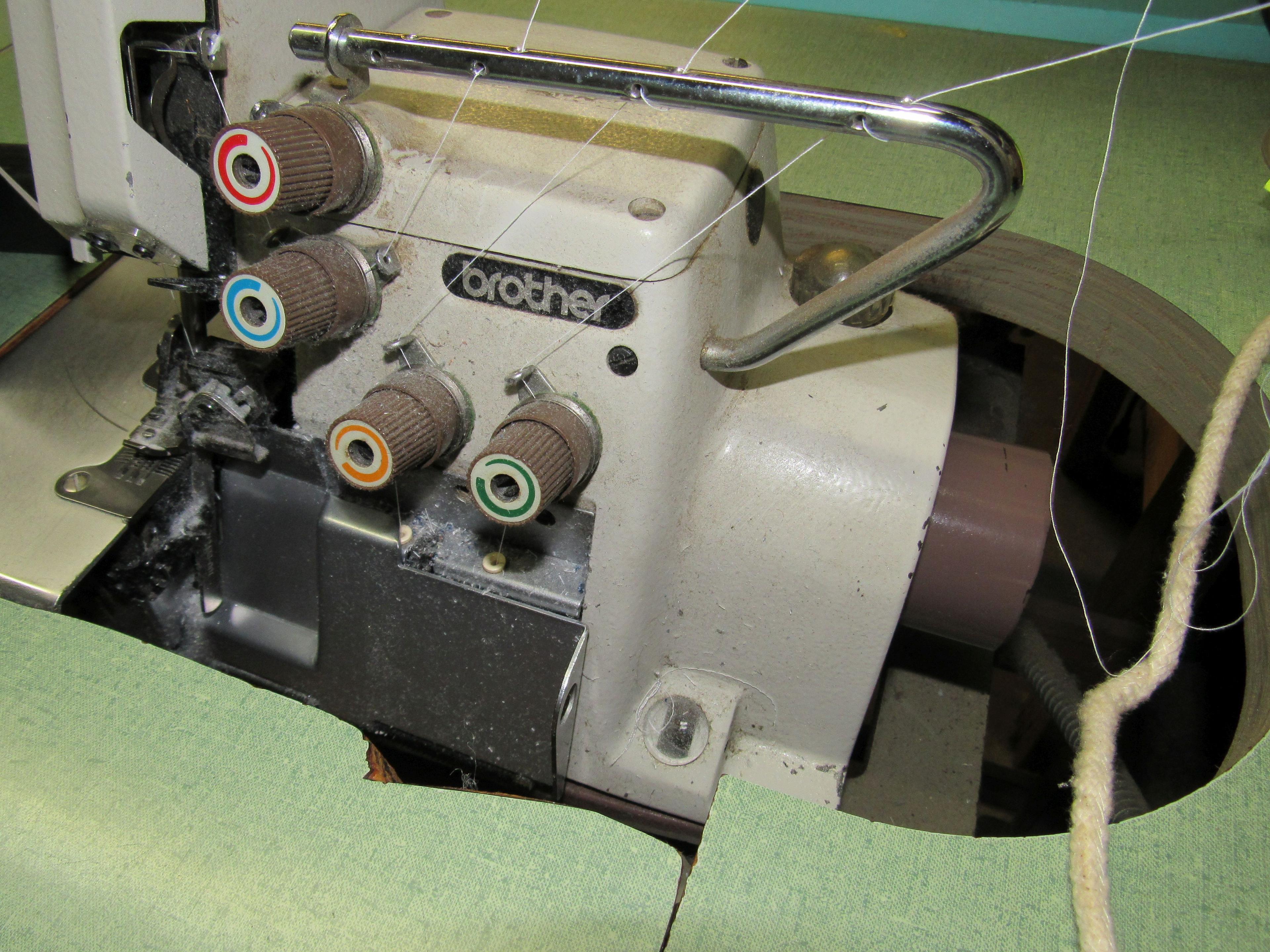 4 spool Brothers Serger machine with table