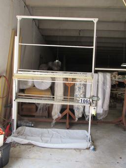 upright drapery folding machine will take 3 witdths of drapes