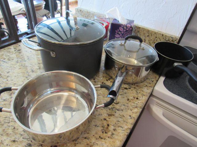 mixed cookware, pots and pans, frying pans