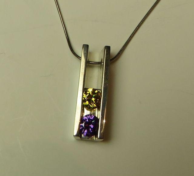 Sterling pendant w/2 c.z. (dark yellow & purple) on 16" sterling chain