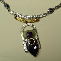 Silver tone 18" necklace w/5 purple c.z. stones