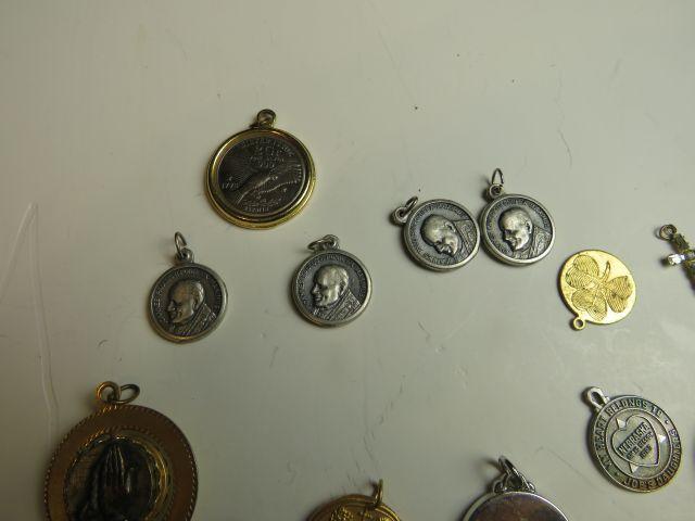 mixed pendants and charms including 4 Papal medals, pendant with swivel center cross and praying han
