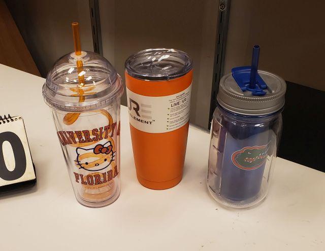 mixed Gator water bottles and tumblers