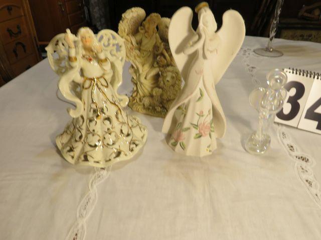 group of 4 ceramic and glass angel figures (angel on right is lighted.