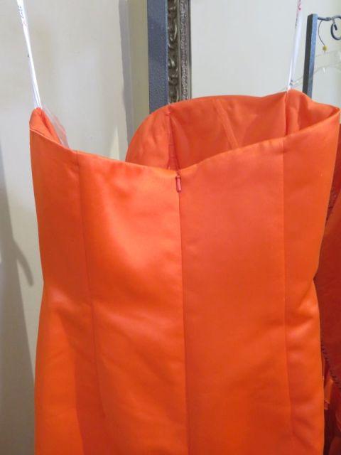 Xcite, size 8, tangerine colored strapless, prom or pageant dress!  Bust 36; Waist 27.5; Hips 39. Ne