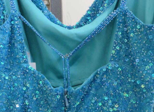 Hand-made turquoise, size 11/12, Scala silk dress with sequins galore.  Perfect for prom or homecomi