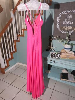 Xcite, size 6,  fuchsia-colored prom dress with spaghetti straps.