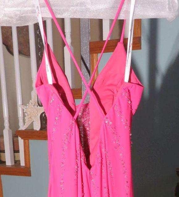 Xcite, size 6,  fuchsia-colored prom dress with spaghetti straps.