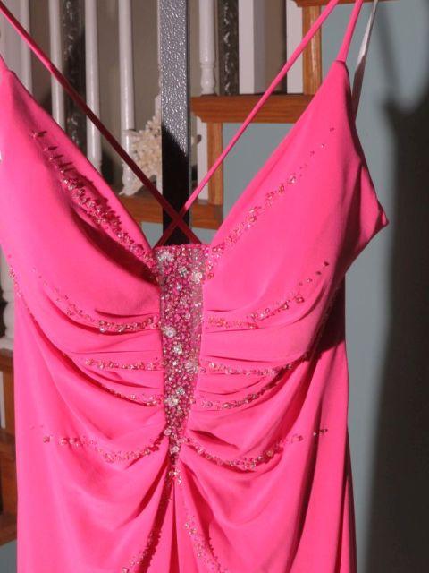 Xcite, size 8,  fuchsia-colored prom dress with spaghetti straps.