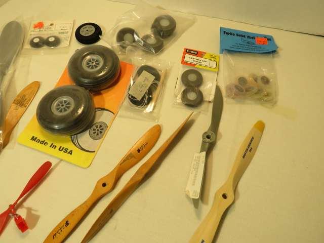 group of mixed model airplane tires, wheels and propellors