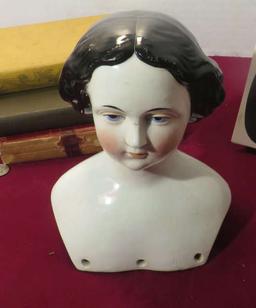 antique porcelain doll head contains provenance stating that it was saved by a young girl had to eva