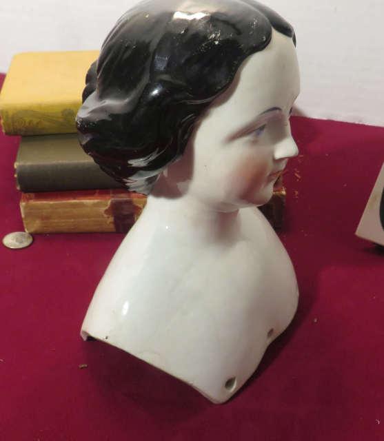 antique porcelain doll head contains provenance stating that it was saved by a young girl had to eva