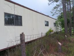 1997 Euba Office trailer comes some desks, and built in shelving.  Aluminum entrance stairs.  No evi