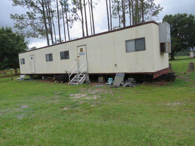 1997 Euba Office trailer comes some desks, and built in shelving.  Aluminum entrance stairs.  No evi