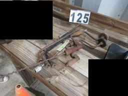 mixed primitive tools, tire irons, wood braces and bits