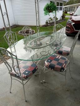 wrought iron patio set with glass table