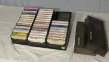 collection of 39 cassette music tapes in 3 plastic tape containers