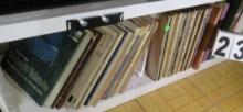 60's and 70s 33 rpm records with jackets lower shelf under tv