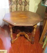 walnut octagon shaped lamp table with 4 turned legs 19 “ high x 27” diameter