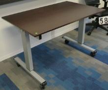 Metal table on casters with wood grain top, 48"w x 30"d x 30"h