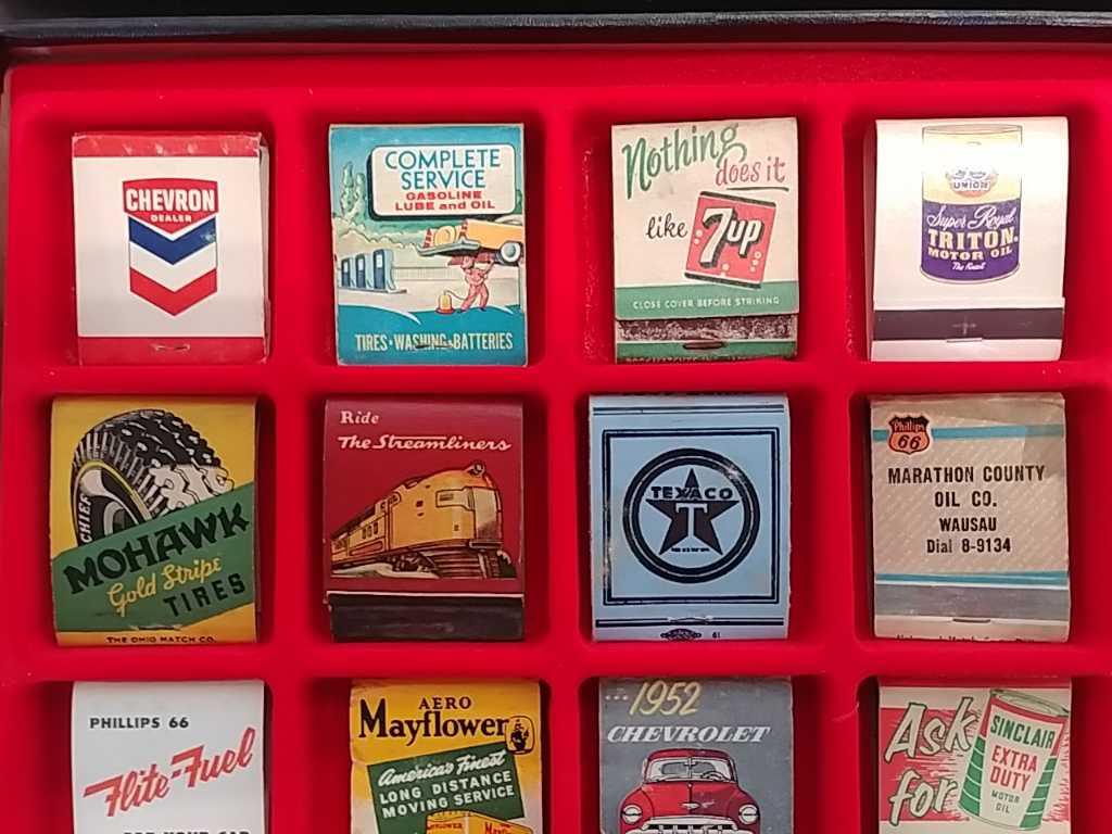 35 Advertising matchbooks in display case