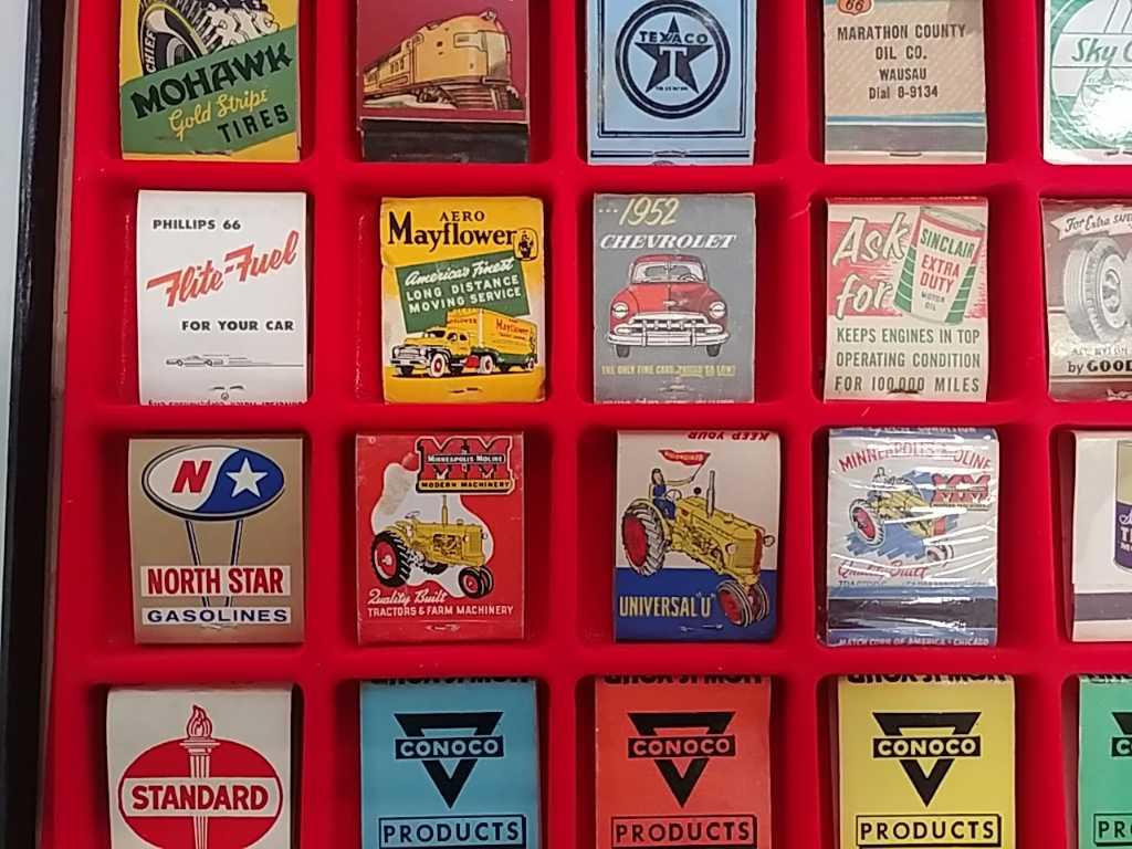 35 Advertising matchbooks in display case