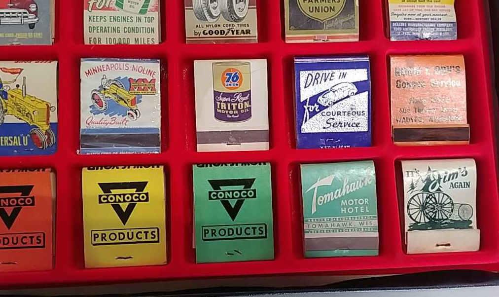 35 Advertising matchbooks in display case