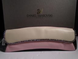 "Jaguar" Daniel Swarovski, champagne, pink & black lambskin clutch with pink strap.