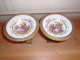 Pair of Fragonard porcelain pedestal plates, man and woman motif.