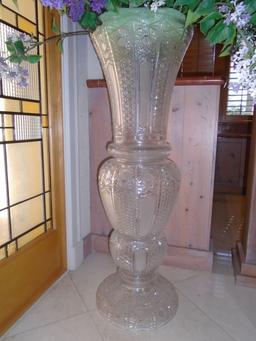 Large crystal Vase with purple and white silk flowers.