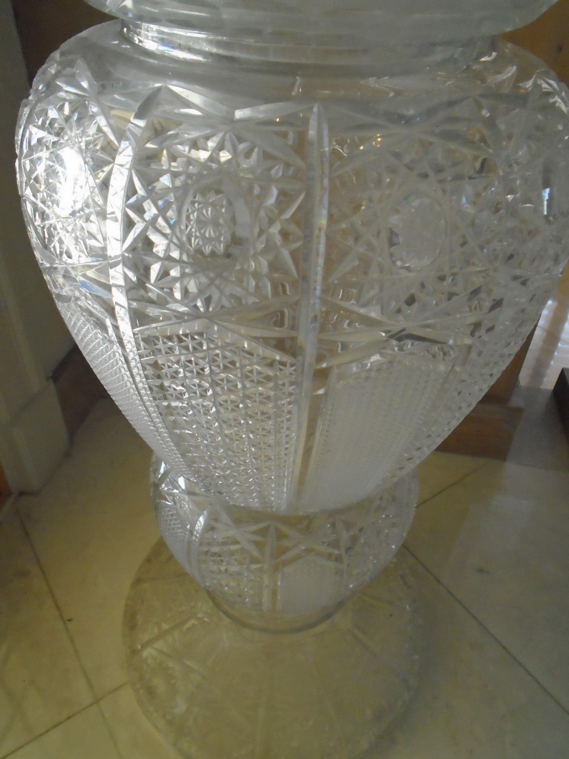 Large crystal Vase with purple and white silk flowers.