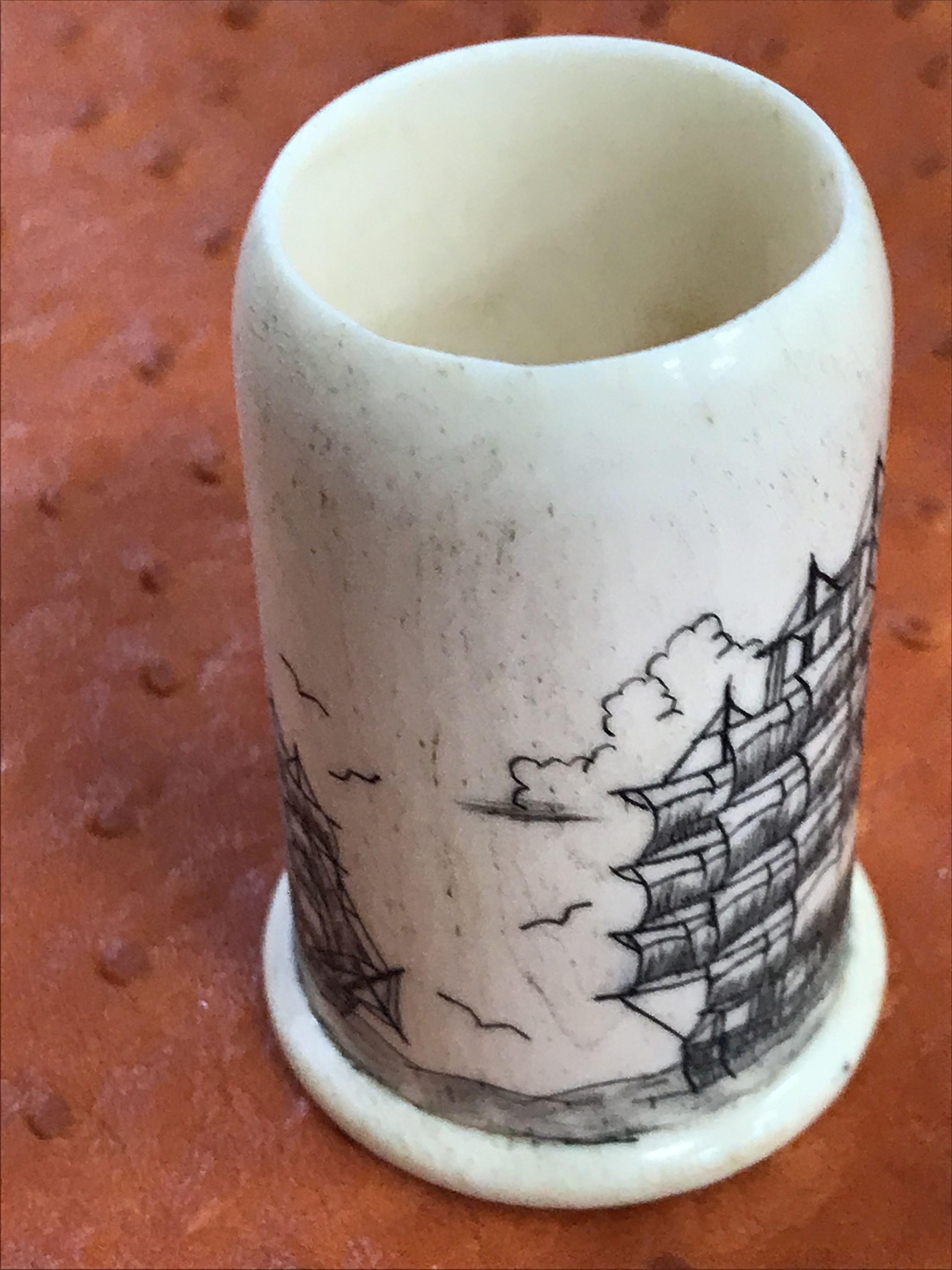 Antique miniature beautifully designed scrimshaw cylindric holder with marine sail boat curving on t