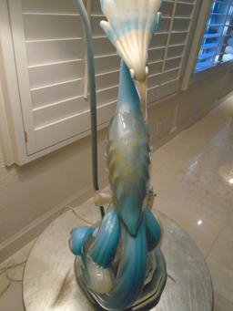 Table lamp with light blue and white glass bird.