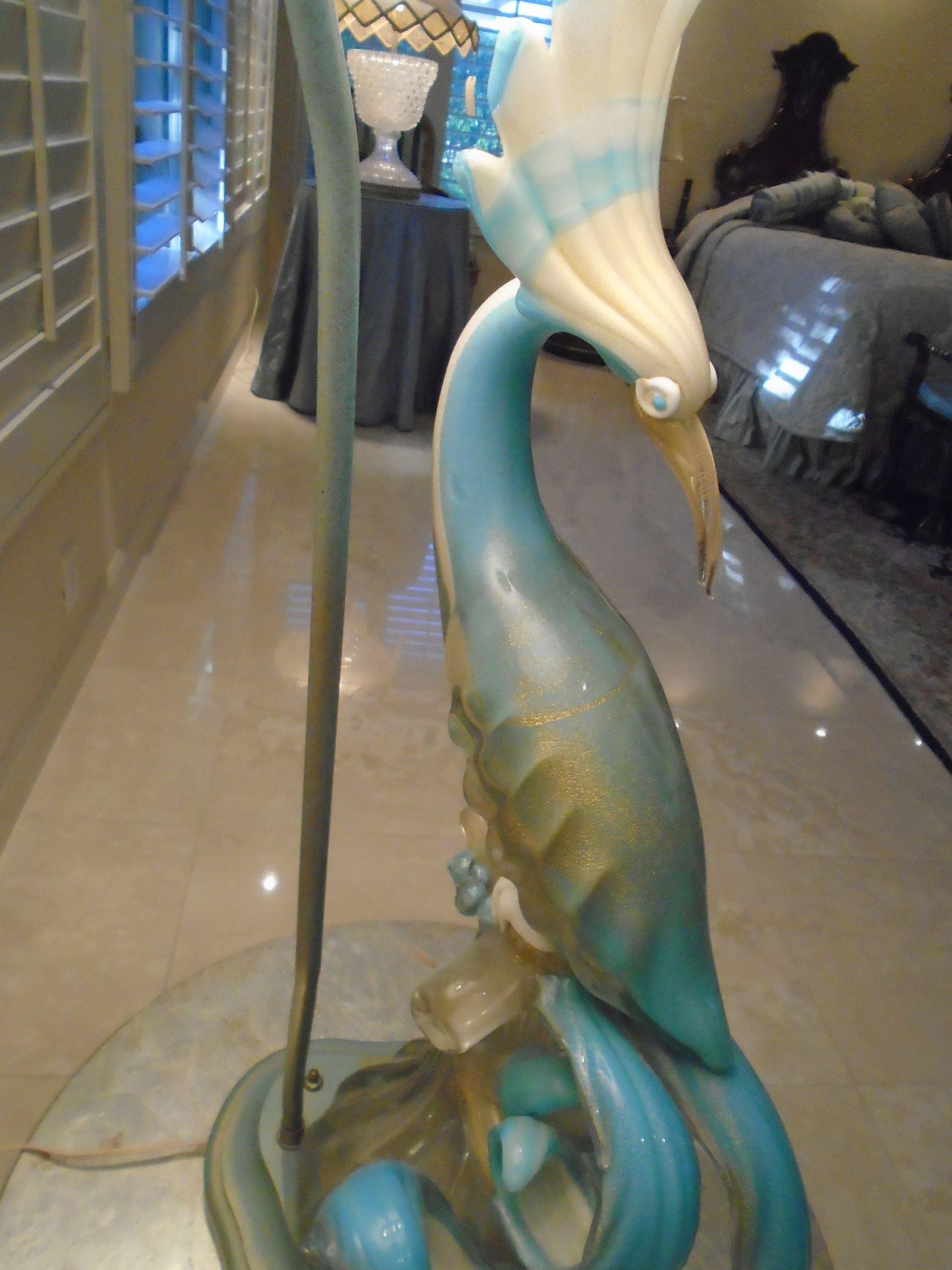 Table lamp with light blue and white glass bird.