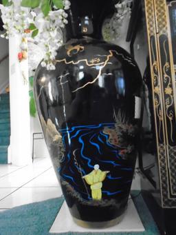 Large black painted vase with Chinese motif.