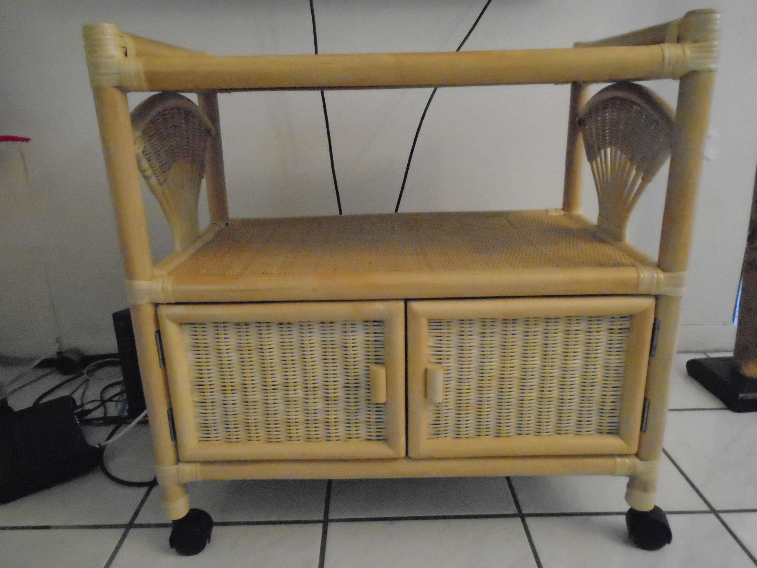 Wicker TV Stand on wheels with a double door cabinet.