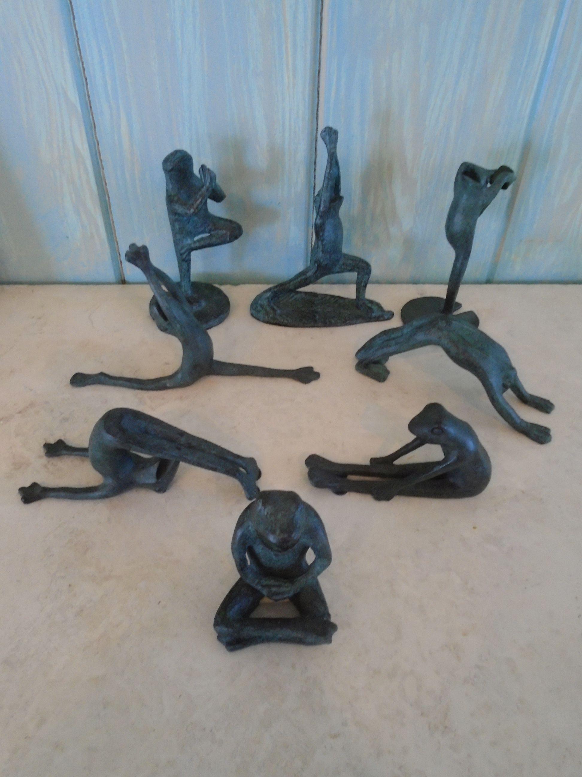 Set of 8 Metal Yoga Frogs.