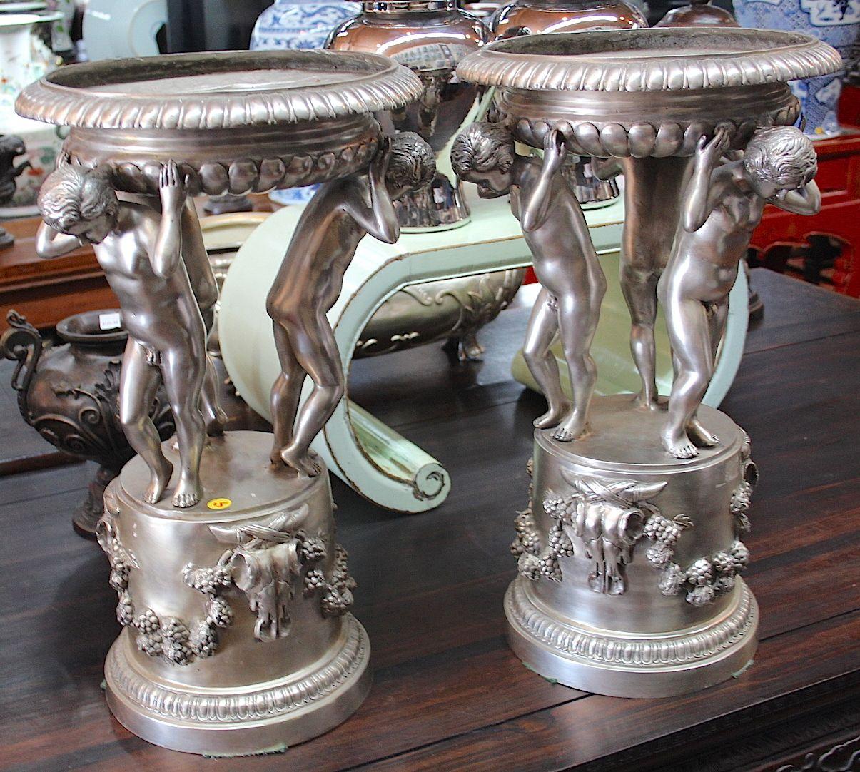 One pair  Bronze with silver Neo French fruit holders with three men designs